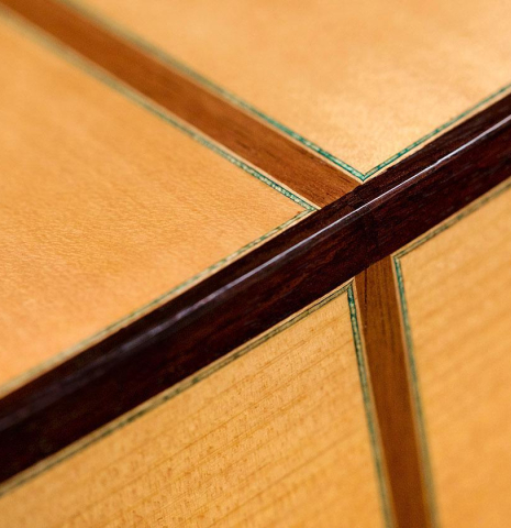 The back and sides at the foot of a 2018 Gerundino Fernandez Hijo cedar/cypress "Blanca" flamenco guitar with pegs