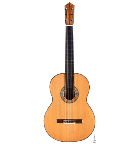 The front of a 2018 Gerundino Fernandez Hijo cedar/cypress "Blanca" flamenco guitar with pegs on a white background