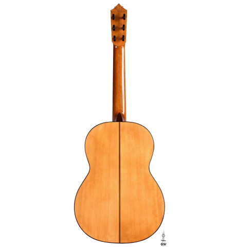 The back of a 2018 Gerundino Fernandez Hijo cedar/cypress "Blanca" flamenco guitar with pegs on a white background
