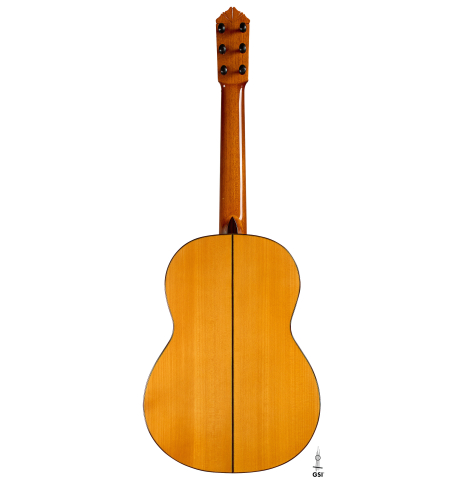 The back of a 1999 Gerundino Fernandez w/pegs flamenco guitar made of spruce and cypress