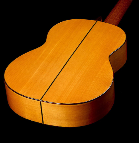 The back and sides of a 1999 Gerundino Fernandez w/pegs flamenco guitar made of spruce and cypress