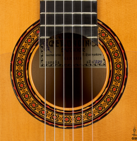 The rosette of a 1999 Gerundino Fernandez w/pegs flamenco guitar made of spruce and cypress