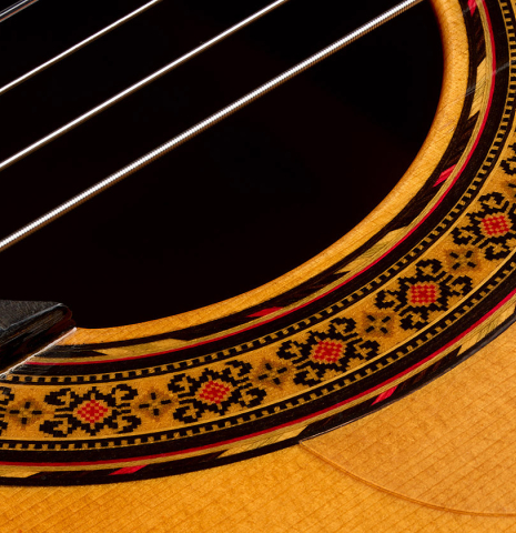Close-up of the rosette of a 1999 Gerundino Fernandez w/pegs flamenco guitar made of spruce and cypress
