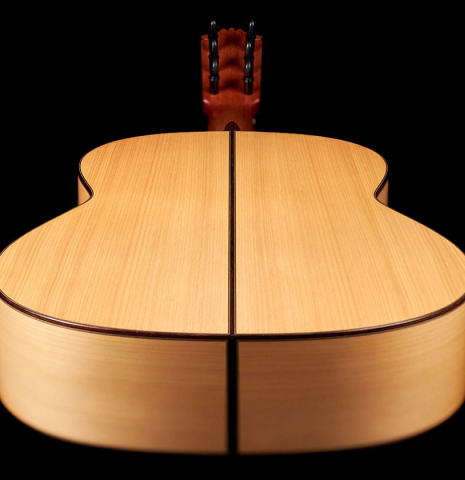 The lower bout of a 1989 Arcangel Fernandez flamenco guitar w/pegs made with spruce and cypress.