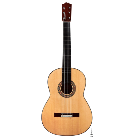 The front of a 1989 Arcangel Fernandez flamenco guitar w/pegs made with spruce and cypress.