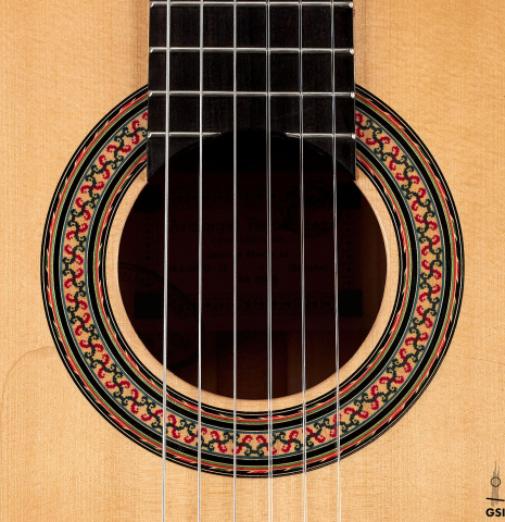 The rosette of a 1989 Arcangel Fernandez flamenco guitar w/pegs made with spruce and cypress.