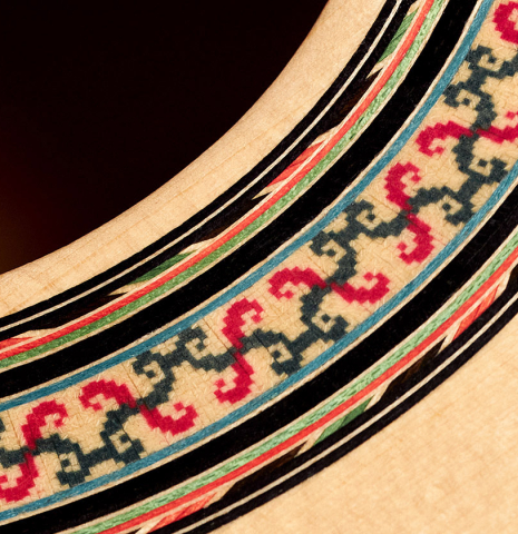 The rosette of a 1989 Arcangel Fernandez flamenco guitar w/pegs made with spruce and cypress.
