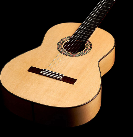 The front of a 1989 Arcangel Fernandez flamenco guitar w/pegs made with spruce and cypress.