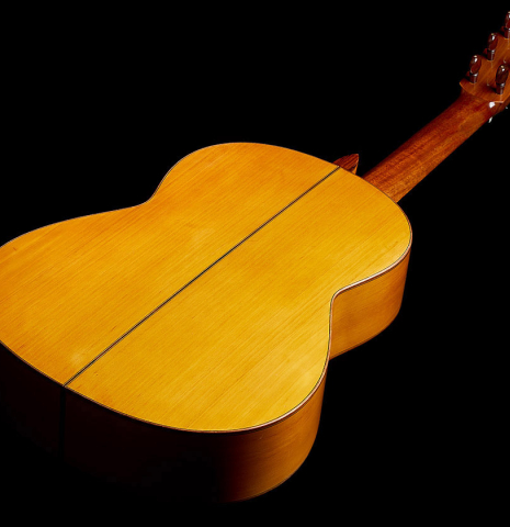 The back and sides of a 1961 Arcangel Fernandez flamenco blanca guitar with pegs made of spruce and cypress.