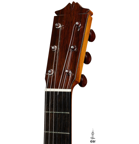 The headstock of a 1961 Arcangel Fernandez flamenco blanca guitar with pegs made of spruce and cypress.
