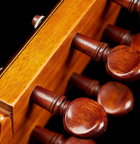 The traditional peghead of a 1961 Arcangel Fernandez flamenco blanca guitar with pegs made of spruce and cypress.
