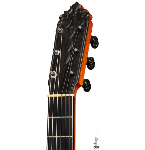 The carved peghead of a 1971 Jeronimo Pena Fernandez "Flamenco Negra" w/pegs made of spruce and Honduran rosewood