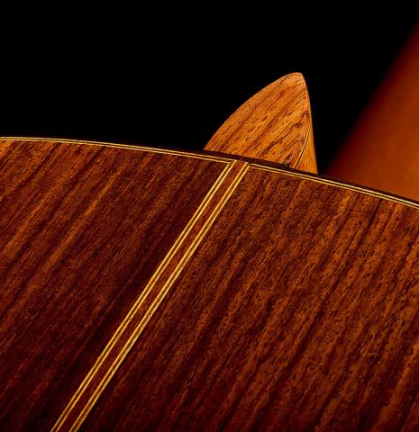 The heel, back binding and purfling of a 1975 Gerundino Fernandez "Negra" flamenco guitar made of spruce and Indian rosewood