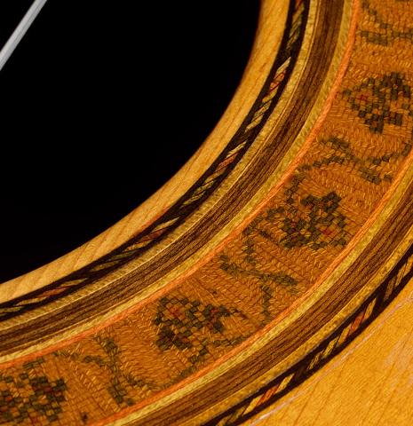 The top and rosette detail of a 1975 Gerundino Fernandez "Negra" flamenco guitar made of spruce and Indian rosewood