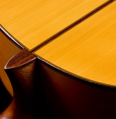 The heel, back binding and purfling of a 1970 Arcangel Fernandez flamenco guitar made of spruce and cypress