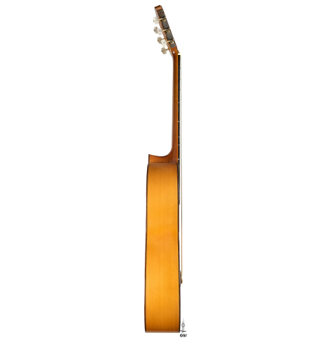 The side of a 1970 Arcangel Fernandez flamenco guitar made of spruce and cypress