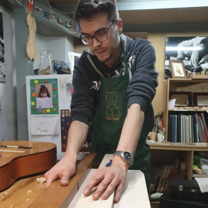 Juan Fregenal at work on a guitar at his bench in his Granada workshop