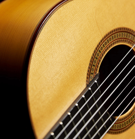 The soundboard and side of a 2024 Dario Garcia flamenco guitar made of spruce and cypress