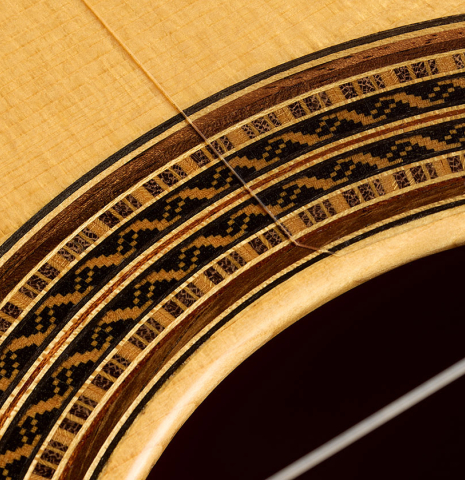 The top and rosette detail of a 2025 Darío García flamenco guitar made of spruce and cypress