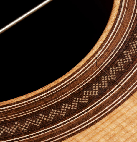 Closeup detail of the rosette of a 2025 Darío García "Flamenco Negra" guitar made of spruce and kamagong
