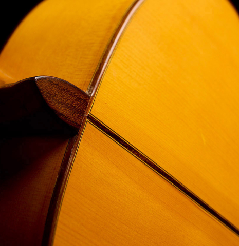 The heel, neck and shoulders of a 1998 Gerundino Fernandez flamenco guitar made of spruce and cypress