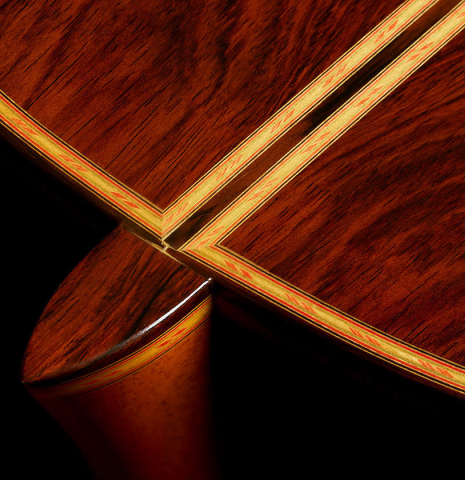 The heel, back binding and purflings of a 2006 Conde Hermanos "Felipe V" flamenco negra guitar made of spruce and CSA rosewood