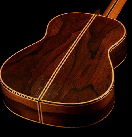 The back and sides at the foot of a 2006 Conde Hermanos "Felipe V" flamenco negra guitar made of spruce and CSA rosewood