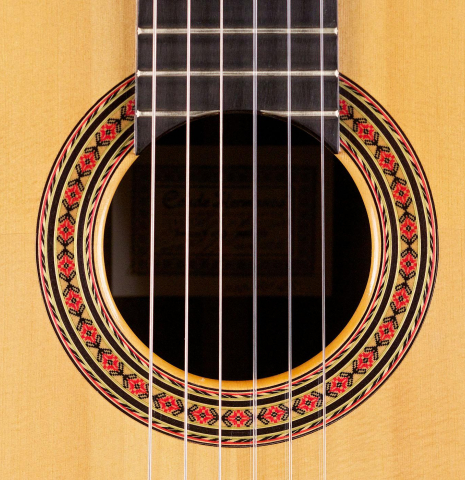 The rosette of a 2006 Conde Hermanos "AF 25" flamenco guitar made with spruce and Indian rosewood.