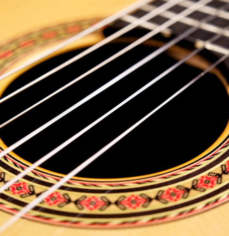 The rosette of a 2006 Conde Hermanos "AF 25" flamenco guitar made with spruce and Indian rosewood.