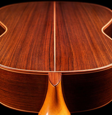 The back of a 2006 Conde Hermanos "AF 25" flamenco guitar made with spruce and Indian rosewood.