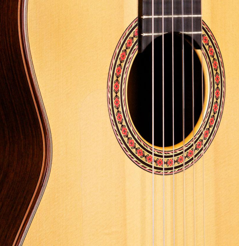 The soundboard of a 2006 Conde Hermanos "AF 25" flamenco guitar made with spruce and Indian rosewood.