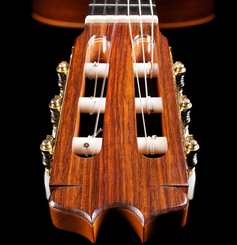 The headstock of a 2006 Conde Hermanos "AF 25" flamenco guitar made with spruce and Indian rosewood.