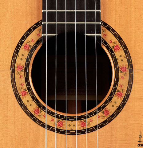 The rosette of a 2000 Conde Hermanos "AF 25/R" flamenco guitar made with spruce and CSA rosewood.