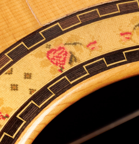 The rosette of a 2000 Conde Hermanos "AF 25/R" flamenco guitar made with spruce and CSA rosewood.