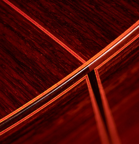The back and sides at the foot of a 2011 Felipe Conde "FC 27" flamenco guitar made with spruce and Indian rosewood