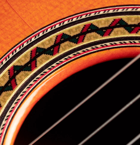 A close-up of the rosette of a 2011 Felipe Conde "FC 27" flamenco guitar made with spruce and Indian rosewood