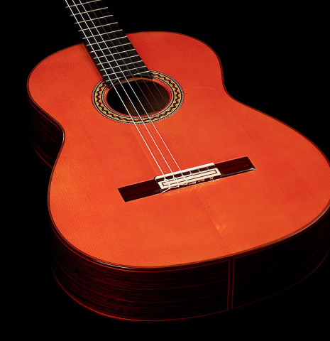 The soundboard and rosette of a 2011 Felipe Conde "FC 27" flamenco guitar made with spruce and Indian rosewood