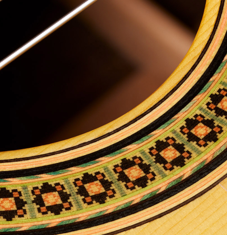 Close-up detail of the rosette of a 2008 Conde Hermanos "AF 25/R" flamenco guitar made with spruce and CSA rosewood.