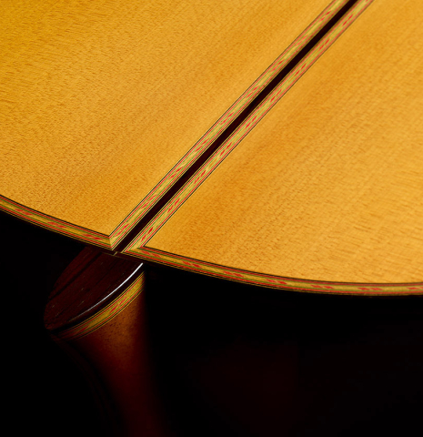 The heel, back binding and purfling of a 2006 Conde Hermanos "Felipe V" flamenco guitar made of spruce and cypress
