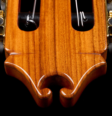 The carved headstock shape of a 2025 Juan Hernandez "Flamenca Profesional" flamenco guitar made of spruce and cypress