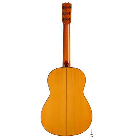 The back of a 1992 Conde Hermanos w/pegs flamenco guitar made of spruce and cypress