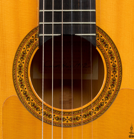 The rosette of a 1992 Conde Hermanos w/pegs flamenco guitar made of spruce and cypress