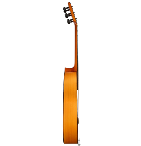 The side of a 1992 Conde Hermanos w/pegs flamenco guitar made of spruce and cypress