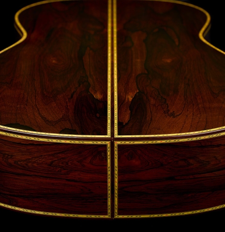 The back and sides at the foot of a 2001 Conde Hermanos "Felipe V" flamenco negra guitar made of cedar and CSA rosewood