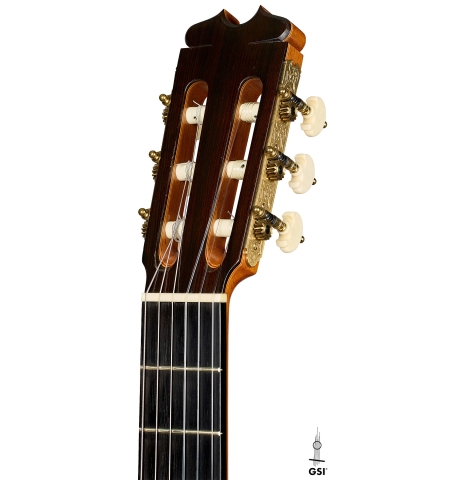 The headstock of a 2001 Conde Hermanos "Felipe V" flamenco negra guitar made of cedar and CSA rosewood