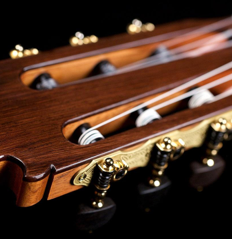 The headstock and tuning machines of a Wolfgang Jellinghaus "Flamenca Blanca" flamenco guitar made of spruce and cypress
