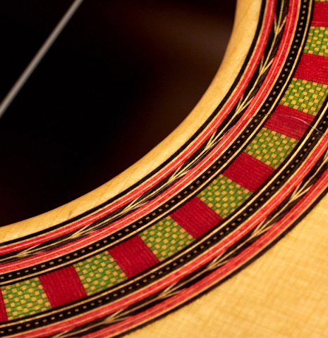 The rosette of a 2023 Wolfgang Jellinghaus "Flamenca Negra" flamenco guitar with spruce and Granadillo.