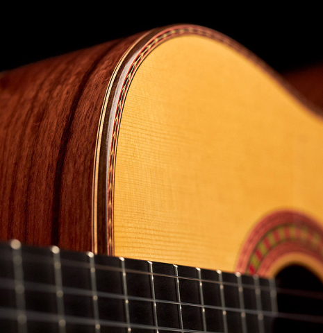 The soundboard of a 2023 Wolfgang Jellinghaus "Flamenca Negra" flamenco guitar with spruce and Granadillo.