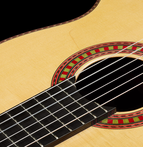 The top and rosette of a 2024 Wolfgang Jellinghaus "Flamenca Negra" flamenco guitar made of spruce and granadillo