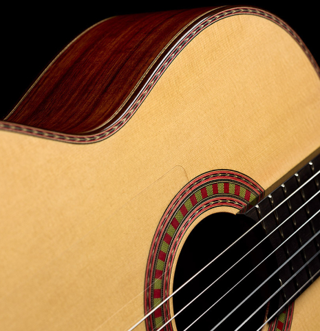 The soundboard and rosette of a 2026 Wolfgang Jellinghaus "Flamenca Negra" flamenco guitar made of spruce and granadillo